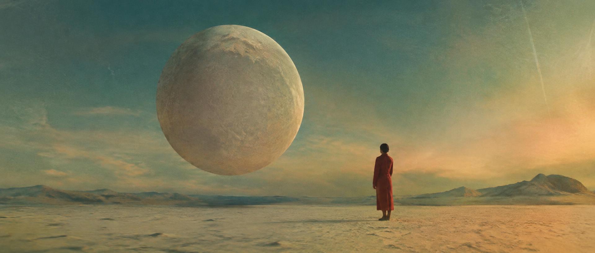 Surreal film still: a figure in a red coat beneath a floating moon